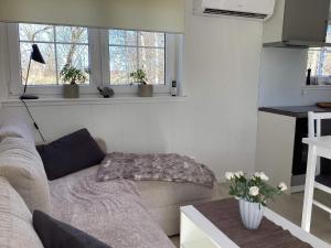 a living room with a couch and a table at 4 star holiday home in BRÅLANDA in Brålanda