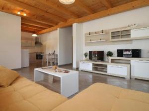 a living room with a couch and a table at Villa in minj with swimming pool in Žminj