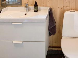 a bathroom with a sink and a toilet at 6 person holiday home in Røros in Røros +34 photos