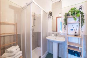 a bathroom with a shower and a sink at A Me Casa - Taormina in Taormina