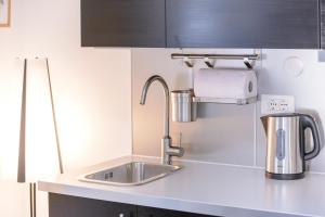 Kuchyň nebo kuchyňský kout v ubytování Apartment MiNo
