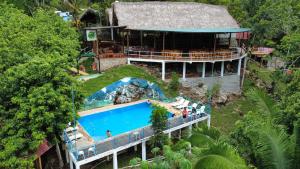 an aerial view of a resort with a swimming pool at El Portal De Champey in Lanquín