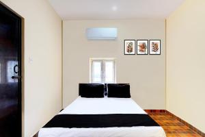 Postel nebo postele na pokoji v ubytování Hotel O Eswar RR Residency + 21 fotografií
