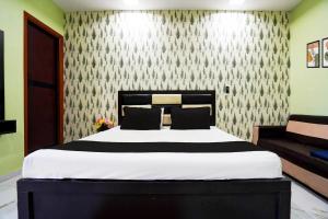 Ένα ή περισσότερα κρεβάτια σε δωμάτιο στο Hotel O Sun