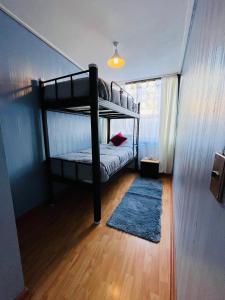Katil atau katil-katil dalam bilik di Agua Santa Apartment