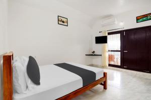 Hotel O Ocean Queen Palace Hotel客房内的一张或多张床位