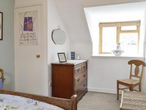 Ένα ή περισσότερα κρεβάτια σε δωμάτιο στο Larch Cottage