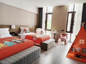 Rúm í herbergi á Beijing Suiyu Hotel