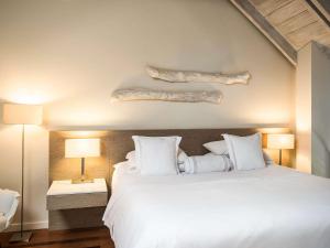 Voodi või voodid majutusasutuse Hotel Boutique Bovedas de Santa Clara By Accor toas