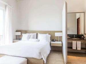 Voodi või voodid majutusasutuse Hotel Boutique Bovedas de Santa Clara By Accor toas