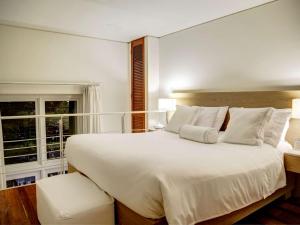 Voodi või voodid majutusasutuse Hotel Boutique Bovedas de Santa Clara By Accor toas