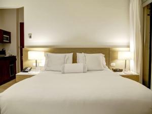 Voodi või voodid majutusasutuse Hotel Boutique Bovedas de Santa Clara By Accor toas