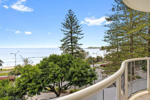 a balcony with a view of the ocean at Zanzibar 404, Sensational 2 Bedroom Oceanview Apartment in Mooloolaba