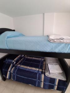Postel nebo postele na pokoji v ubytování Residence FasMin B&B Nayon experience boxing