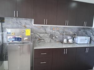 Kuchyň nebo kuchyňský kout v ubytování Residence FasMin B&B Nayon experience boxing