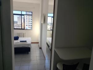 Postel nebo postele na pokoji v ubytování Suite Aconchegante