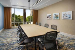 a conference room with a long table and chairs at Courtyard by Marriott Oceanside Fort Lauderdale Beach in Fort Lauderdale +77 photos