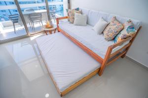 Ένα ή περισσότερα κρεβάτια σε δωμάτιο στο Luxury seafront APT in Santa Marta, ideal to relax in family +35 φωτογραφίες