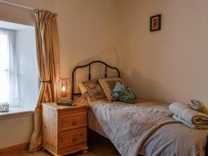 Postel nebo postele na pokoji v ubytování Willesdene Cottage
