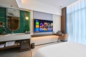 Rúm í herbergi á Beijing Suiyu Hotel