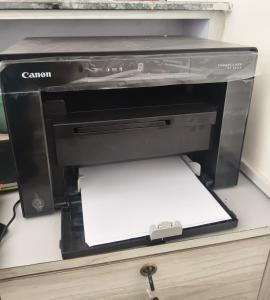 a black printer sitting on top of a drawer at Hotel Bharosa Inn in Kathmandu