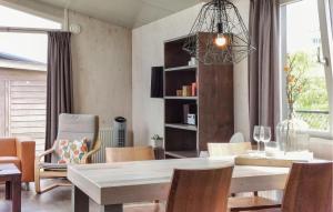 a dining room with a table and chairs at 2 Bedroom Awesome Home In Sint-Annaland in Sint Annaland