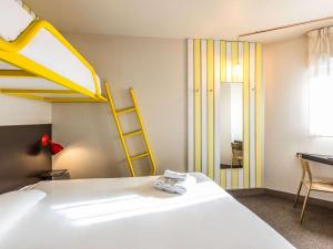 Postel nebo postele na pokoji v ubytování Greet Hotel Limoges Nord