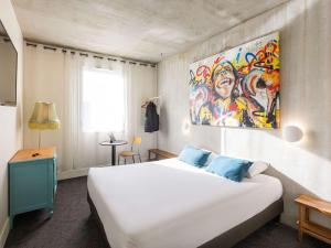 Postel nebo postele na pokoji v ubytování Greet Hotel Limoges Nord