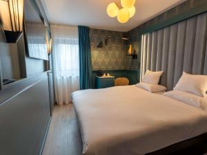 Postel nebo postele na pokoji v ubytování ibis Styles Hasselt City Centre