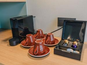 Příslušenství pro přípravu čaje a kávy v ubytování ibis Styles Hasselt City Centre