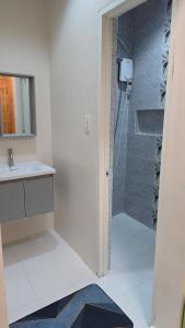 a bathroom with a shower and a sink at Casa Zavia in Sampong