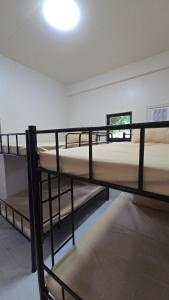 a bedroom with two bunk beds in a room at Casa Zavia in Sampong