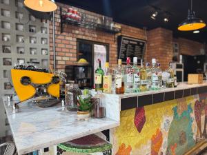 a bar with bottles of alcohol on a counter at Buakao Inn in Thong Sala