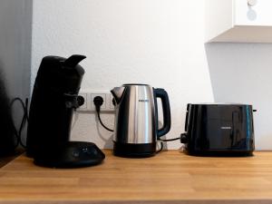 Příslušenství pro přípravu čaje a kávy v ubytování Nice Apartment Marl