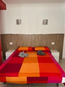 Postel nebo postele na pokoji v ubytování B&B Le Tre Gemme Junior