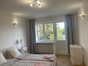 Posteľ alebo postele v izbe v ubytovaní Apartamenty Przy Plaży Gdynia Orłowo