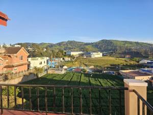 a view of a city from a balcony at Sait's Westhill View Resort in Ooty