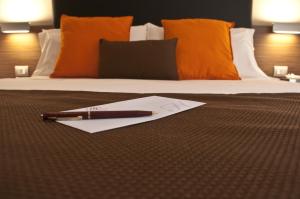 Letto o letti in una camera di Hotel Concordia