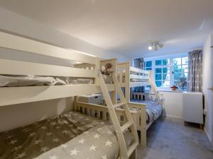 a bunk bed room with two bunk beds and a ladder at The Barn in Hunstanton +17 photos