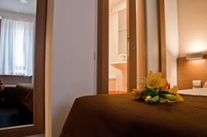 Letto o letti in una camera di Hotel Concordia