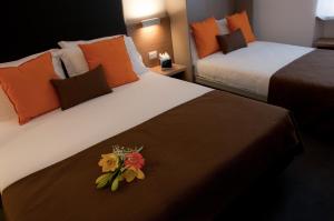 Letto o letti in una camera di Hotel Concordia