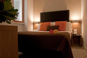 Letto o letti in una camera di Hotel Concordia