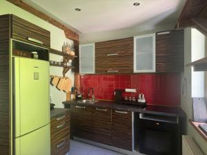 Kuchyň nebo kuchyňský kout v ubytování Upesciema Cottage