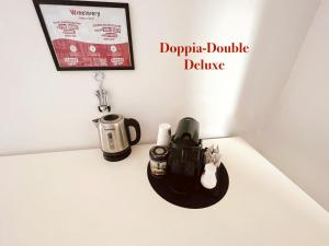 a table with a coffee maker and a tea kettle at DiMoras house Verona in Verona