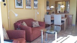 
a living room filled with furniture and a couch at Carabeo 2000 Nerja in Nerja
