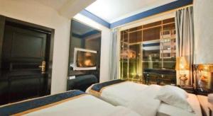 Un ou plusieurs lits dans un hébergement de l'établissement Guilin Sapphire hotel