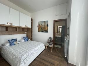 a bedroom with a bed and a chair in it at Belvedere Dei Trabocchi in Ortona