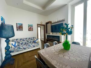 a living room with a table and a couch at Belvedere Dei Trabocchi in Ortona