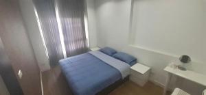 Postel nebo postele na pokoji v ubytování Vee Condo 502