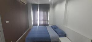 Postel nebo postele na pokoji v ubytování Vee Condo 502